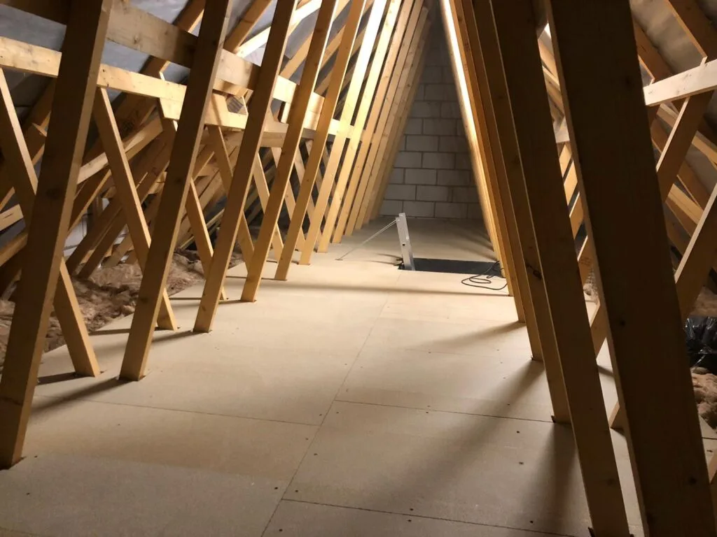 loft boarding with insulation and metal ladder