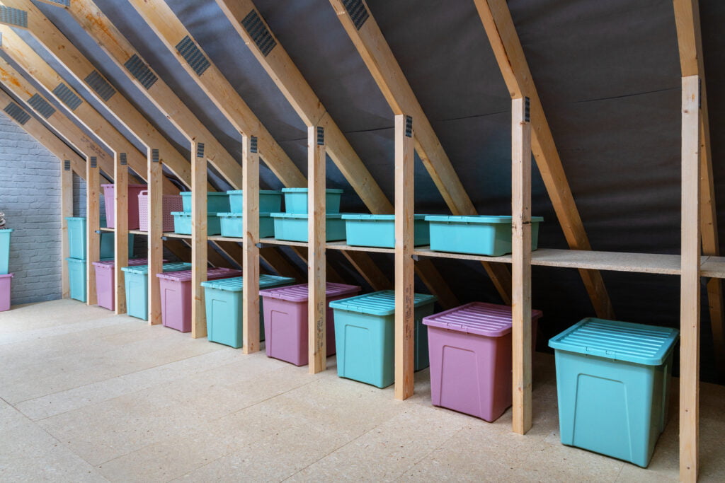 loft boarding with storage areas with coloured storage boxes
